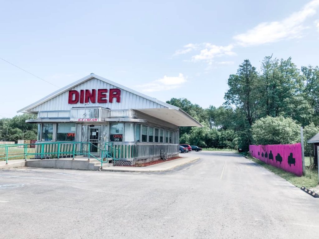 1950's diner building that says DINER on the front