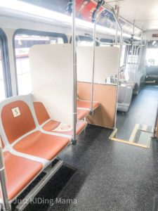 Empty Bus with dividers and a chair with the number 5 on it.