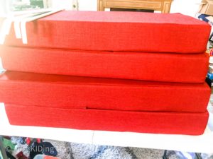 Pile of 4 red rectangular cushions 