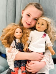 Girl with 2 American Girl Dolls with crazy hair